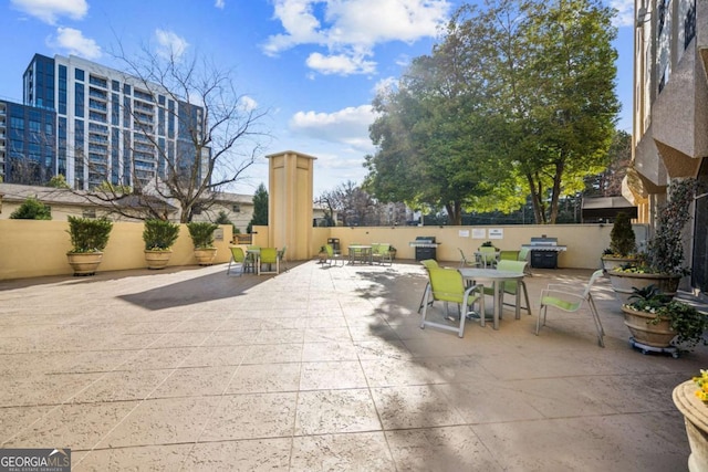 view of patio featuring fence