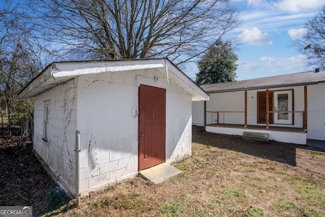 view of shed featuring a porch