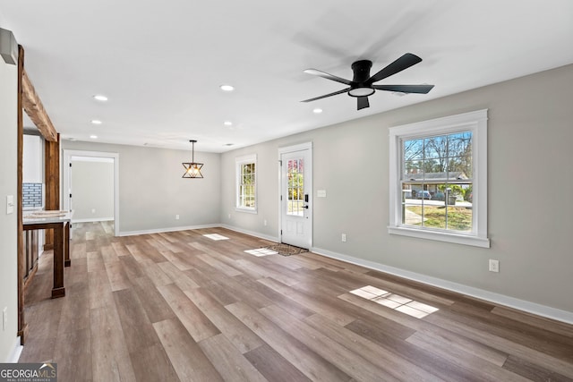 entryway featuring recessed lighting, light wood-type flooring, baseboards, and ceiling fan