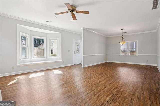 unfurnished living room with dark wood finished floors, baseboards, and visible vents