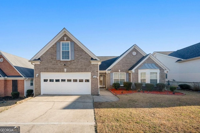 traditional home with a front yard, brick siding, and driveway