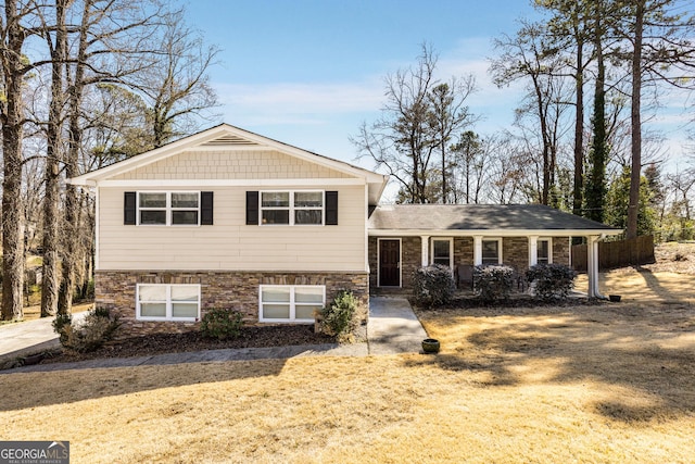 split level home featuring stone siding