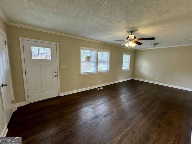 entrance foyer featuring dark wood finished floors, crown molding, and a ceiling fan