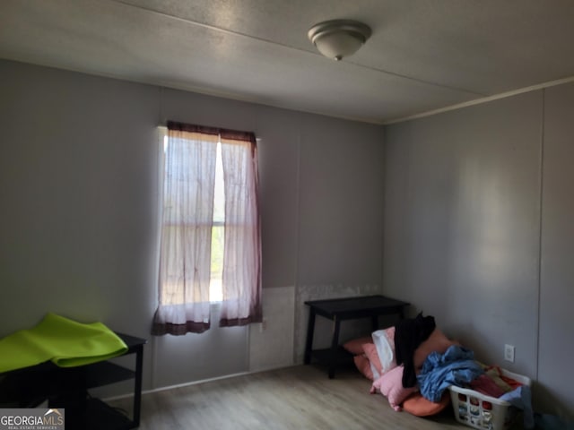 bedroom with wood finished floors