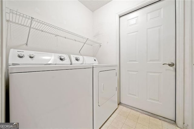 laundry area featuring laundry area and separate washer and dryer