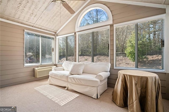 sunroom featuring lofted ceiling, plenty of natural light, and a ceiling fan