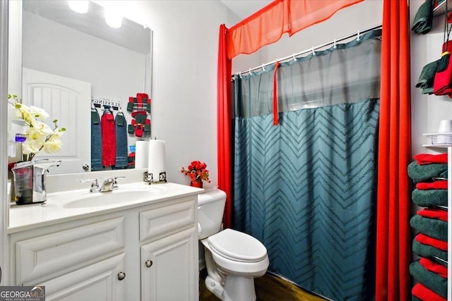 full bathroom with vanity, toilet, and a shower with curtain