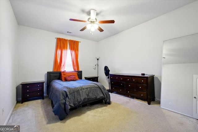 bedroom with visible vents, ceiling fan, baseboards, and carpet floors