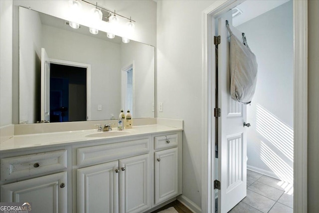 bathroom featuring tile patterned floors and vanity