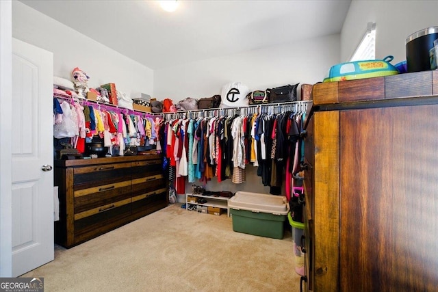 walk in closet featuring carpet