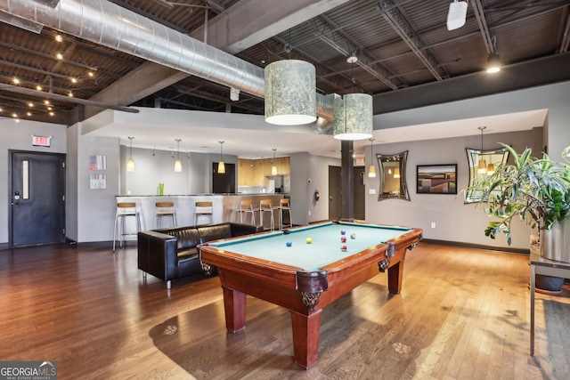 game room with baseboards, a high ceiling, wood finished floors, and pool table