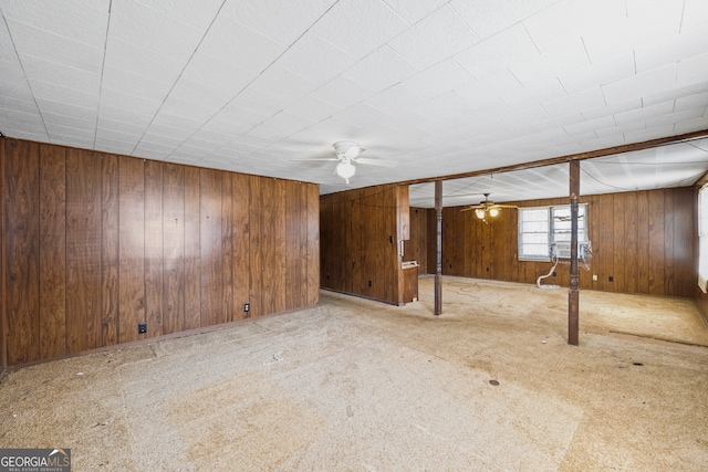 interior space featuring wooden walls and carpet floors