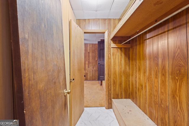 spacious closet featuring marble finish floor