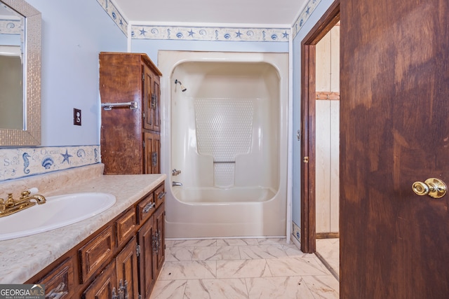 bathroom featuring marble finish floor, vanity, and shower / bathtub combination