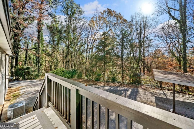 wooden deck with central air condition unit