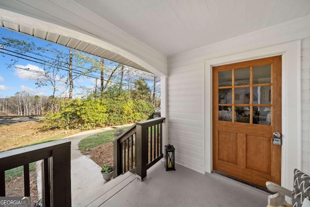 doorway to property featuring a balcony