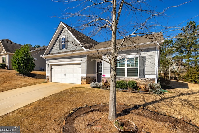 view of front facade with stone siding, concrete driveway, and an attached garage