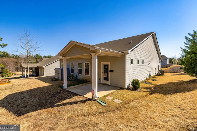 rear view of property with a patio area