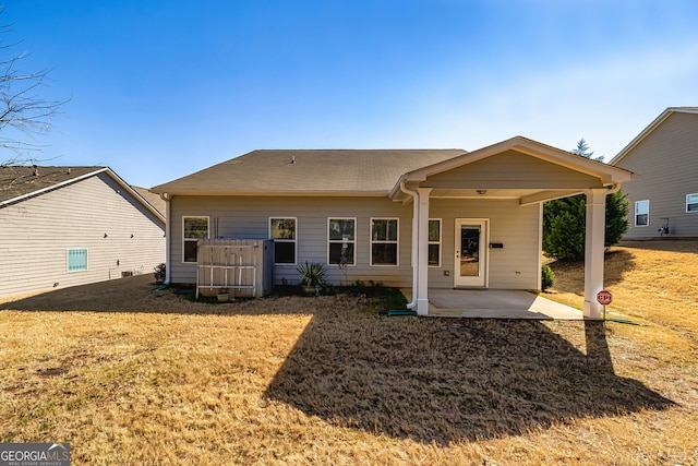 back of property featuring a patio