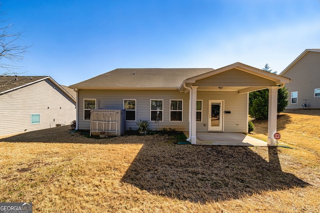 rear view of house featuring a patio