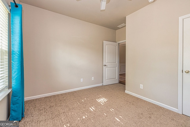 4 October Ave, Newnan, GA 30265 - unfurnished bedroom with carpet floors, baseboards, and ceiling fan