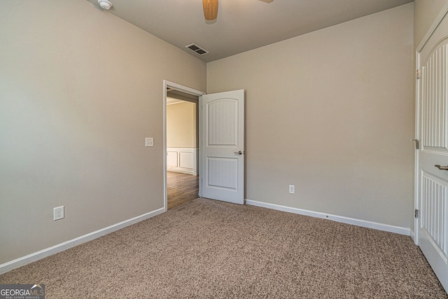 4 October Ave, Newnan, GA 30265 - unfurnished bedroom featuring carpet floors, baseboards, and ceiling fan