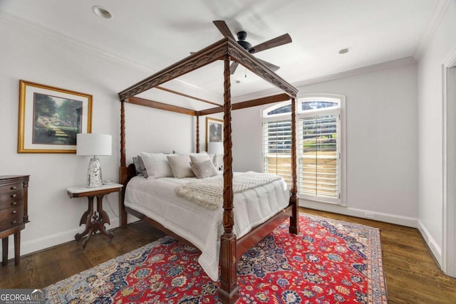 bedroom featuring baseboards, a ceiling fan, wood finished floors, and crown molding