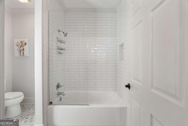 bathroom featuring tub / shower combination, baseboards, toilet, and ornamental molding