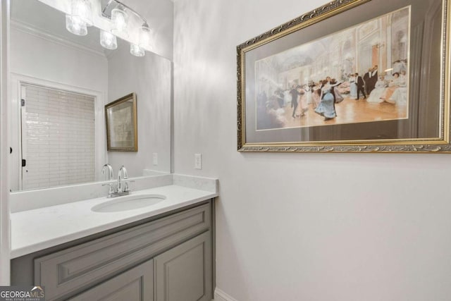 bathroom featuring vanity and crown molding