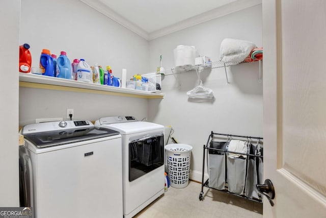 washroom featuring baseboards, laundry area, ornamental molding, washer and dryer, and tile patterned floors