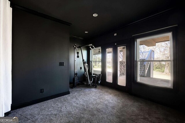 workout room featuring recessed lighting and carpet