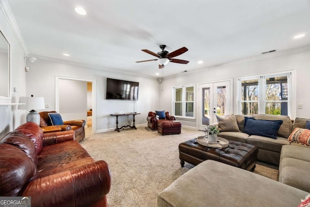 living area with french doors, plenty of natural light, baseboards, and carpet flooring