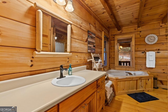 full bath with wood walls, a garden tub, hardwood / wood-style floors, beam ceiling, and wooden ceiling