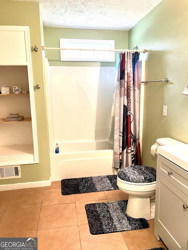 full bathroom with tile patterned flooring, visible vents, a textured ceiling, and shower / tub combo with curtain