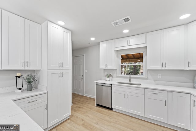 kitchen with visible vents, a sink, stainless steel dishwasher, white cabinetry, and recessed lighting