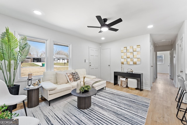 living area featuring recessed lighting, baseboards, a ceiling fan, and light wood finished floors