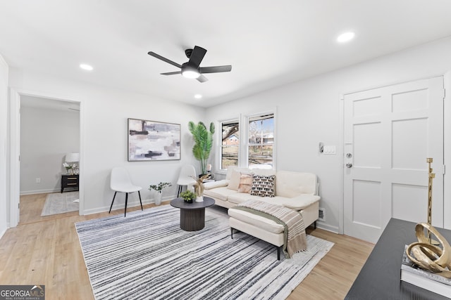 living area with recessed lighting, light wood-type flooring, and ceiling fan