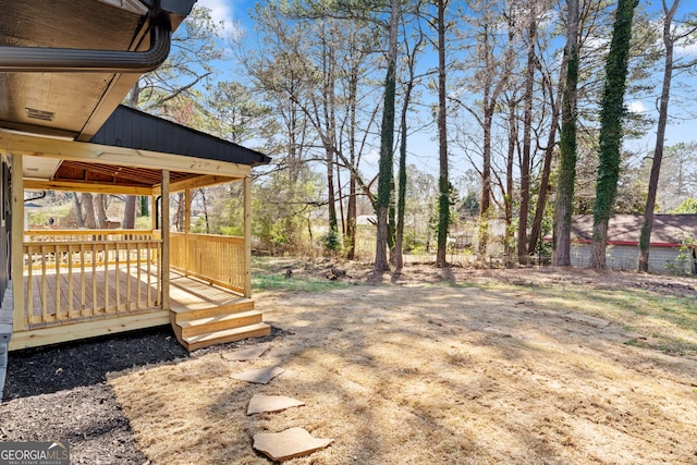 view of yard featuring a deck