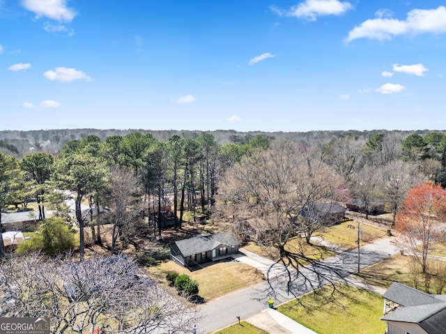 bird's eye view featuring a view of trees