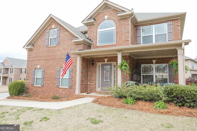 traditional-style house with brick siding