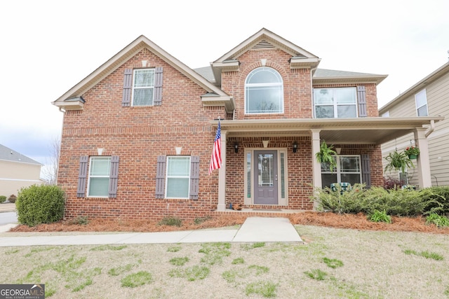 traditional-style home featuring brick siding