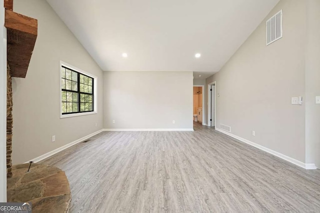 empty room featuring recessed lighting, visible vents, baseboards, and wood finished floors