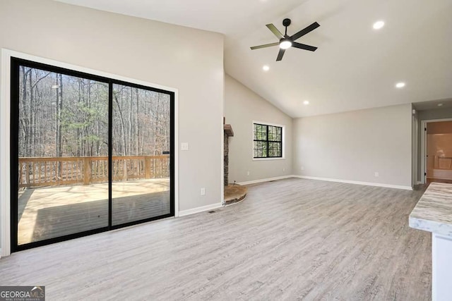 unfurnished living room featuring wood finished floors, baseboards, high vaulted ceiling, recessed lighting, and ceiling fan