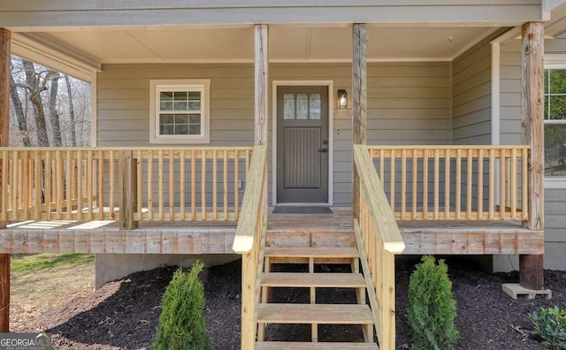 entrance to property featuring covered porch