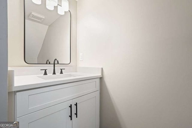 bathroom with visible vents and vanity