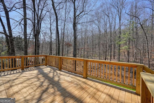 deck featuring a wooded view