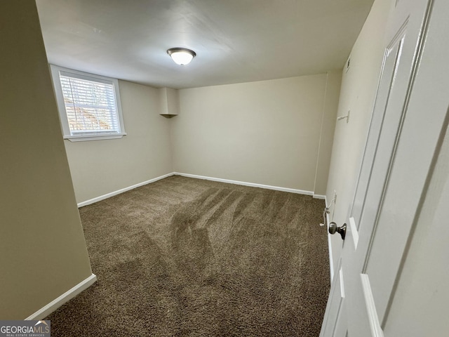 unfurnished bedroom featuring baseboards and carpet floors