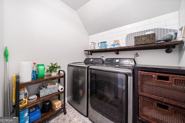 laundry area with washing machine and clothes dryer and laundry area