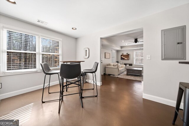 dining space with a ceiling fan, baseboards, visible vents, electric panel, and recessed lighting