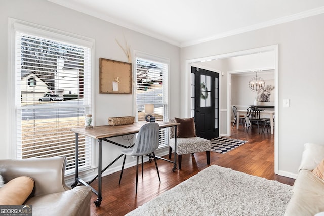 home office featuring a chandelier, baseboards, wood finished floors, and ornamental molding